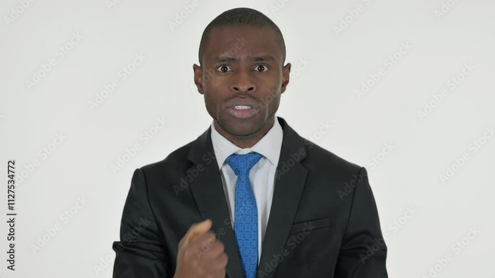 Portrait of Angry African Businessman Talking in Anger on White Background Portrait of Angry African Businessman Talking in Anger on White Background
