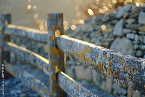 A close-up view of a wooden fence alongside a body of water