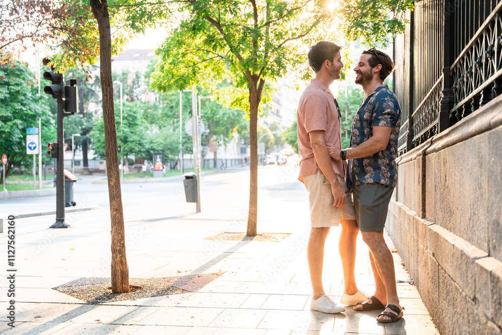 Sunny day city scene with joyful gay couple