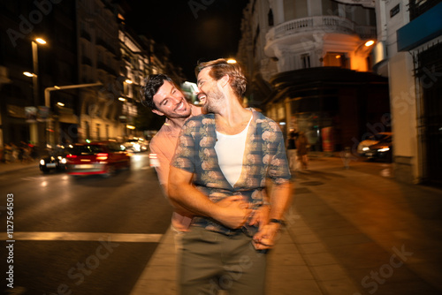 Romantic evening stroll for joyful gay couple in the city