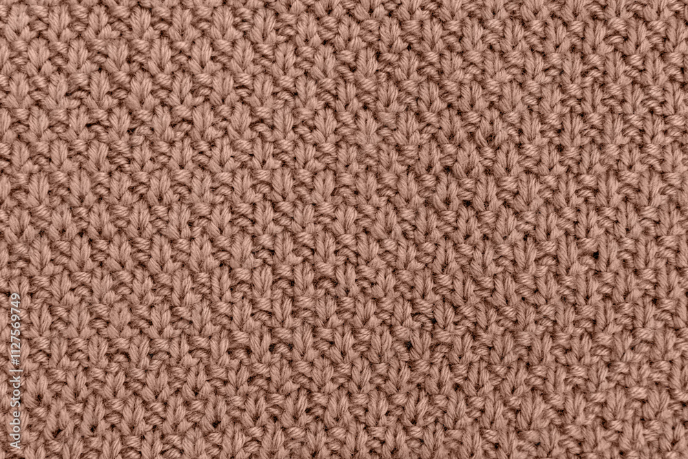Fototapeta premium Knitted pearl wool background. Demonstrating color of 2025 year mocha mousse