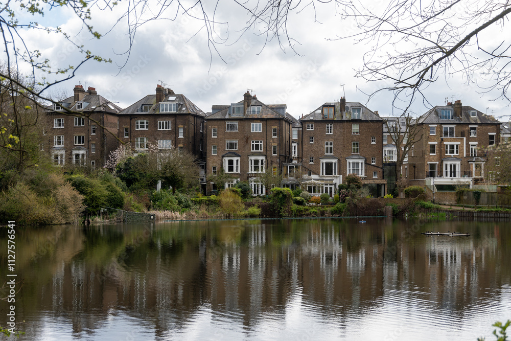 View on urban park Hampstead Heath with ponds, hills and view points, North London, UK