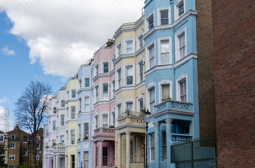 Touristic route on Notting Hill, walking on streets with colourful houses, Portobello road, city life, wealthy neighbourhoods in London, UK photo