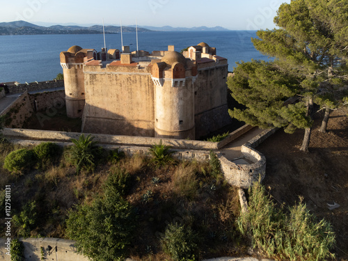 Aerial view on bay, hills,, old citadel fort, olorful houses of famous Saint-Tropez town on French Riviera, Var, Provence, France, summer vacation destination photo