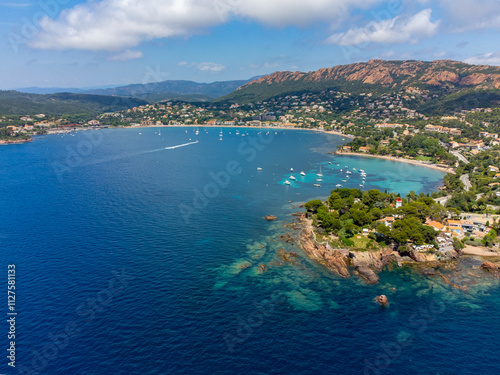 Panoramic view from above on blue Mediterranean dea, sandy beach of Agay town, summer vacation destination near Esterel mountains, French Riviera, Provence. France photo