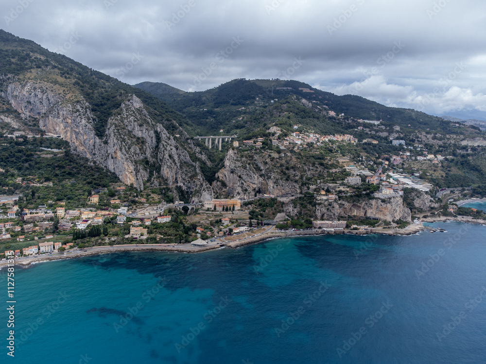 Aerial view on Italian Riviera and Mediterranean Sea from French-Italian border in Grimaldi village, Ventimiglia near San-Remo, travel destination, panoramic view from above Aerial view on Italian Riviera and Mediterranean Sea from French-Italian border in Grimaldi village, Ventimiglia near San-Remo, travel destination, panoramic view from above