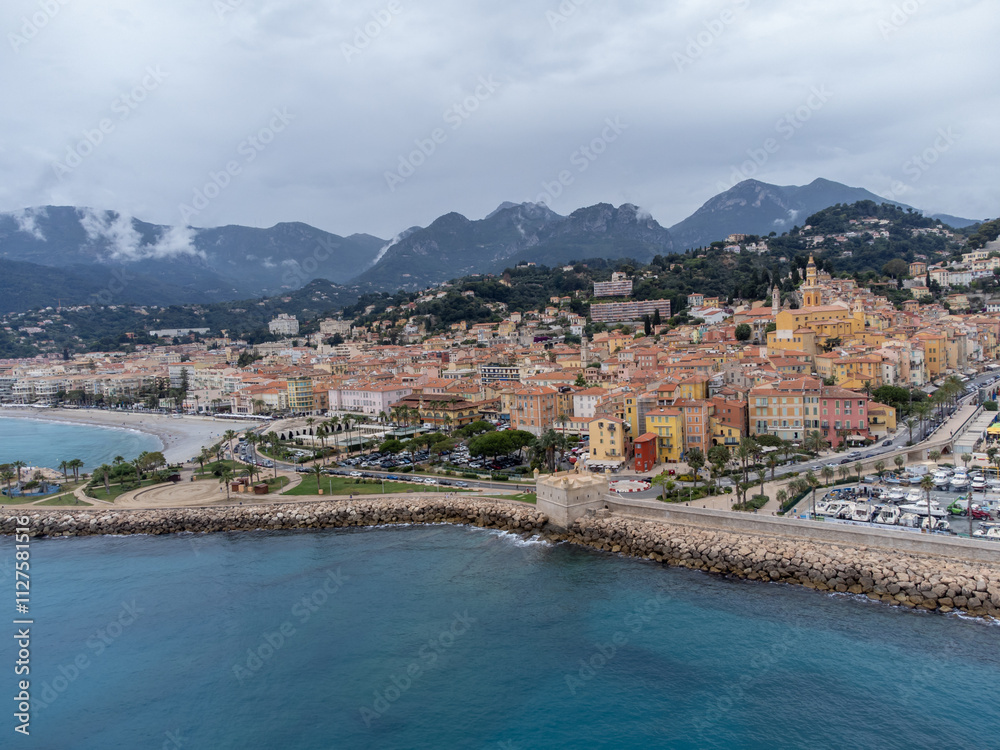 Fototapeta premium Aerial view on French Riviera, colorful Menton old city and marina on Mediterranean Sea near French-Italian border, travel destination, panoramic view from above