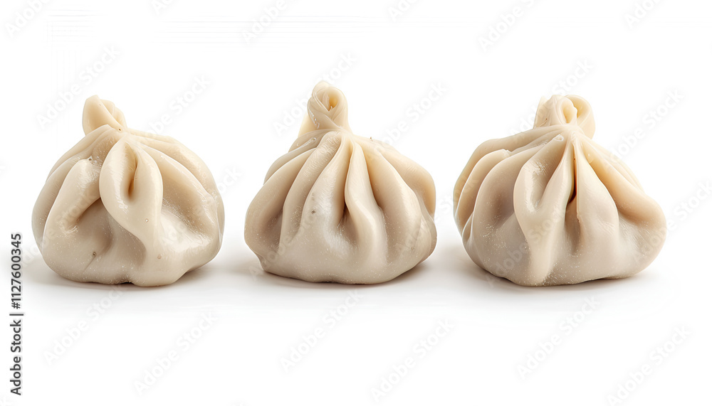 Obraz premium Uncooked khinkali (dumplings) isolated on white. Georgian cuisine