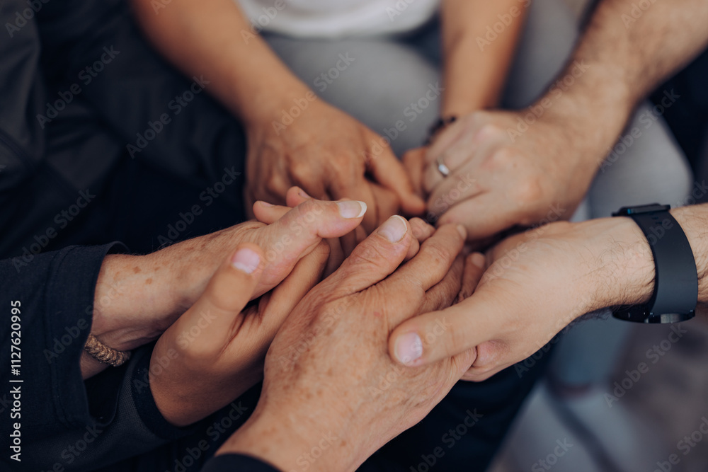 An inspiring image showing hands of various ages held together in a circle, symbolizing the strength and support derived from intergenerational connections and relationships. An inspiring image showing hands of various ages held together in a circle, symbolizing the strength and support derived from intergenerational connections and relationships.