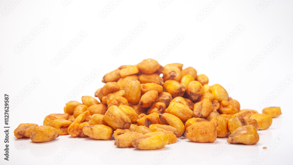 Roasted corn kernels piled on a white surface ready for snacking and cooking Roasted corn kernels piled on a white surface ready for snacking and cooking