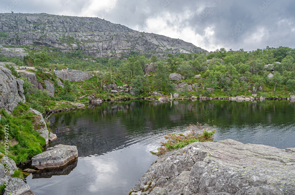 Fototapeta premium Mountain lake on the route to Preikestolen (The Pulpit Rock), a tourist attraction in Rogaland county, Norway