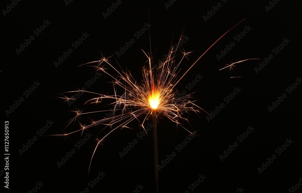 Burning sparkler stick on black background, space for text Burning sparkler stick on black background, space for text