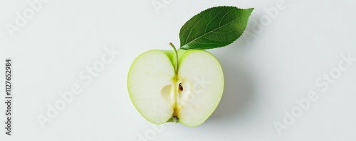top-down view of pristine green apple slice, vibrant leaf attached, crisp white backdrop, minimalist food photography