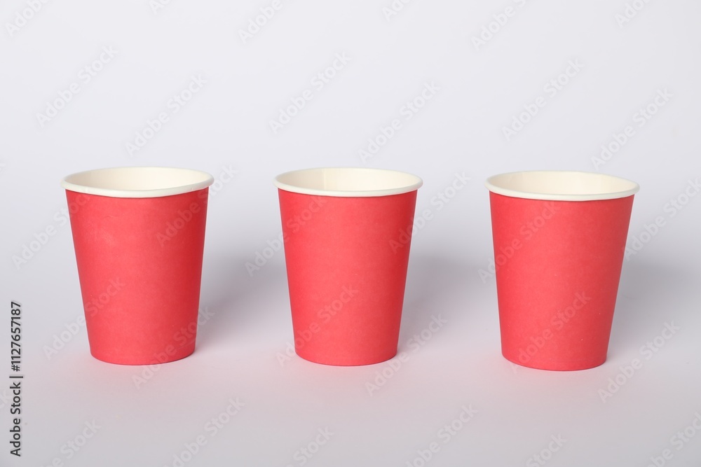 Paper cups on white background. Mockup for design Paper cups on white background. Mockup for design