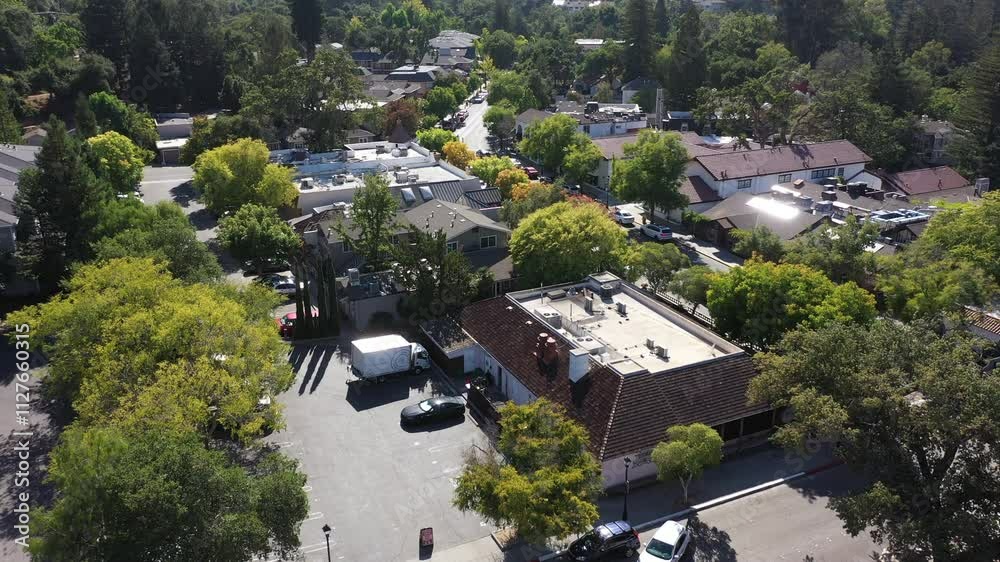 Saratoga, California, USA - August 29, 2024: Afternoon sun shines on historic downtown buildings and autumn trees. Saratoga, California, USA - August 29, 2024: Afternoon sun shines on historic downtown buildings and autumn trees.