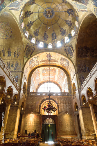 Interior of St Mark's cathedral with golden mosaics, Venice, Italy photo