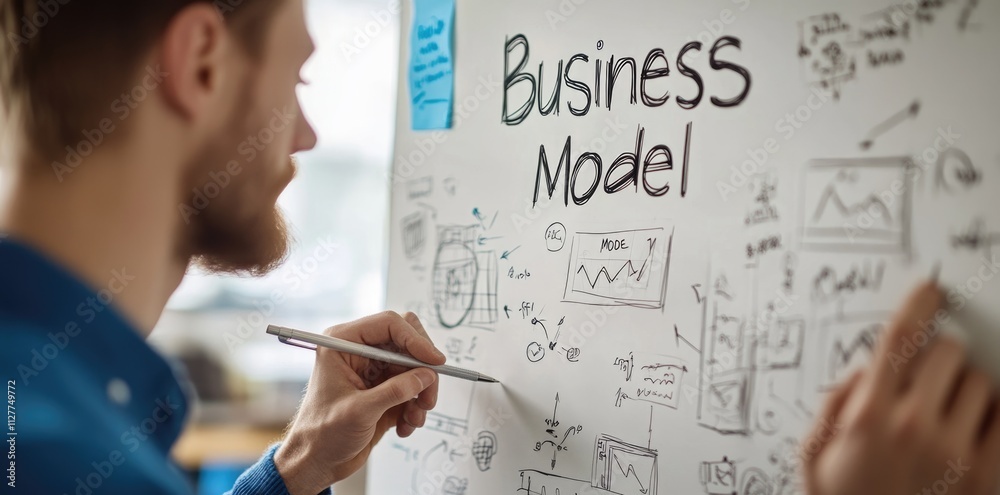 Obraz premium Visionary strategy: business planning through businessman sketching detailed models, strategies for success, focusing on financial technology and marketing flows in a contemporary office environment.