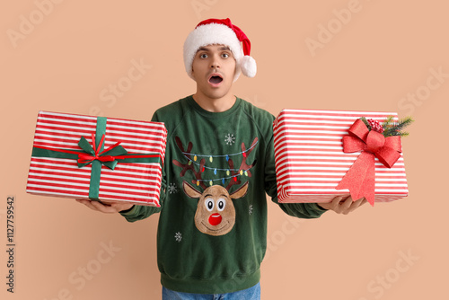 Young man in Santa hat with...