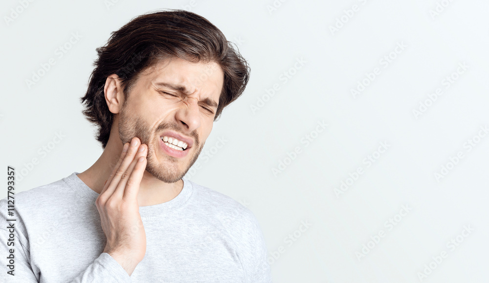 Dental problems concept. Man suffering from bad toothache, empty space Dental problems concept. Man suffering from bad toothache, empty space