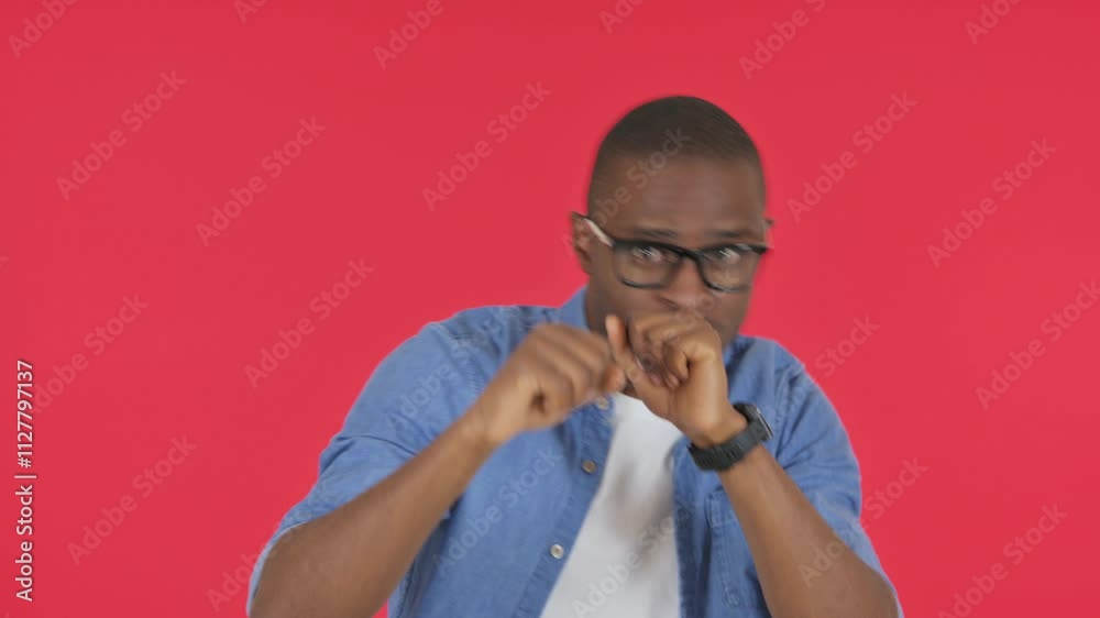 Fighting Casual African Man Boxing on Red Background, Portrait Fighting Casual African Man Boxing on Red Background, Portrait