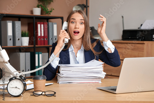 Shocked businesswoman talki...