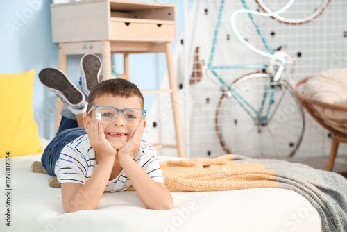 Cute little boy with eyegla...