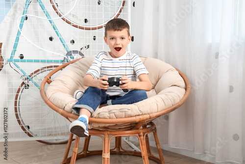 Cute little boy playing vid...