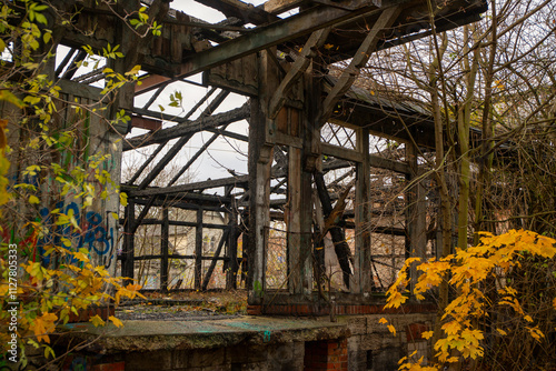 Old abandoned freight yard building with burn marks and vandalism