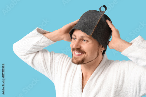Handsome man in sauna felt ...