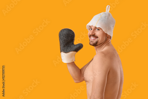 Handsome man in sauna felt ...