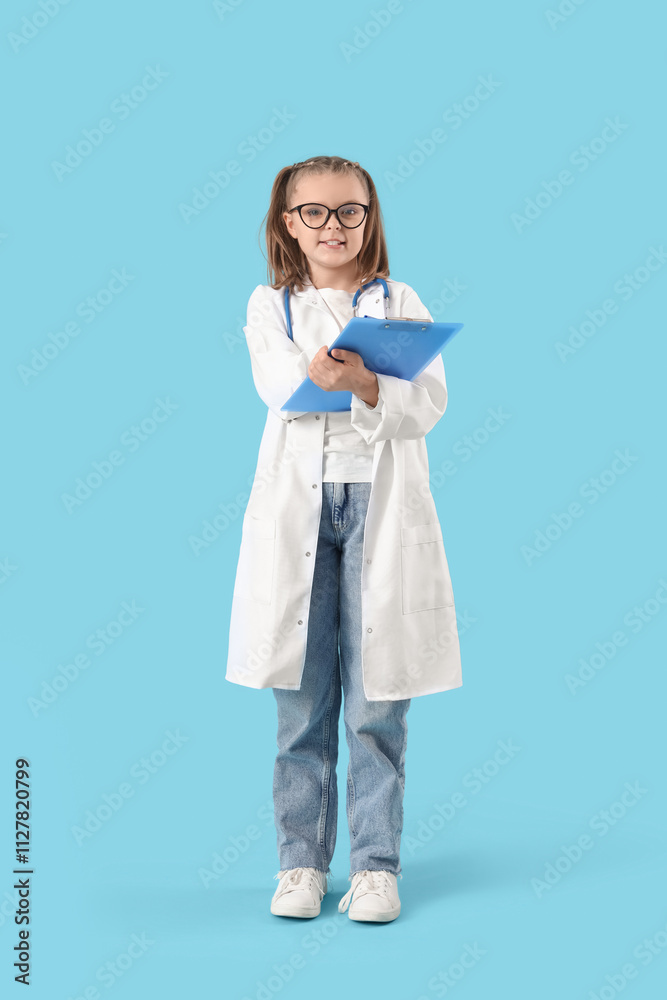 Fototapeta premium Cute doctor with clipboard on blue background