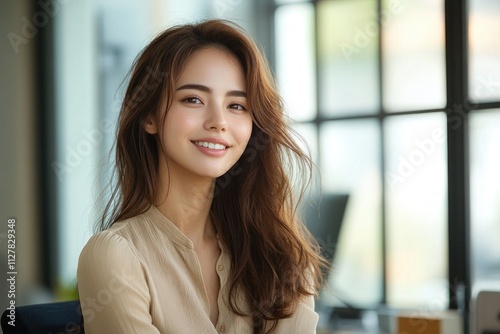Smiling Asian Businesswoman in Serene Office Setting