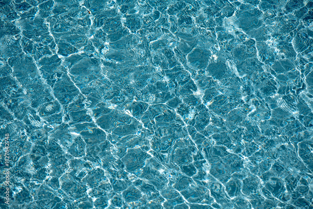 Water texture. View of swimming pool surface. Blue water background. Blue water texture background. Surface of pool water. Water texture. View of swimming pool surface. Blue water background. Blue water texture background. Surface of pool water.