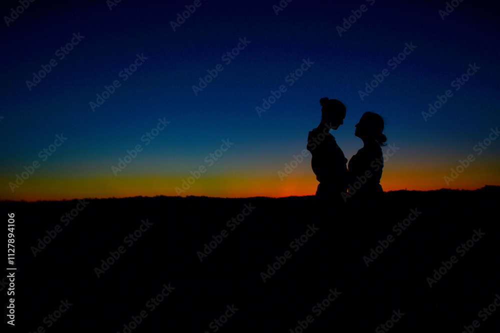 silhouette of a couple on the sunset silhouette of a couple on the sunset