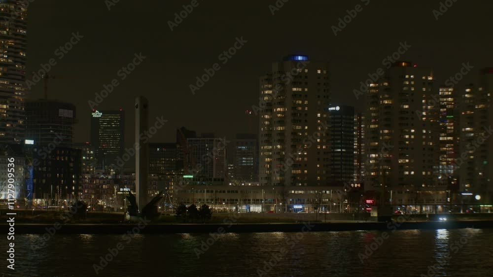 Night city town urban in Europe Netherlands Dutch modern style architecture in Rotterdam after midnight outdoors landscape picturesque view scenery of buildings, houses and skyscrapers Night city town urban in Europe Netherlands Dutch modern style architecture in Rotterdam after midnight outdoors landscape picturesque view scenery of buildings, houses and skyscrapers