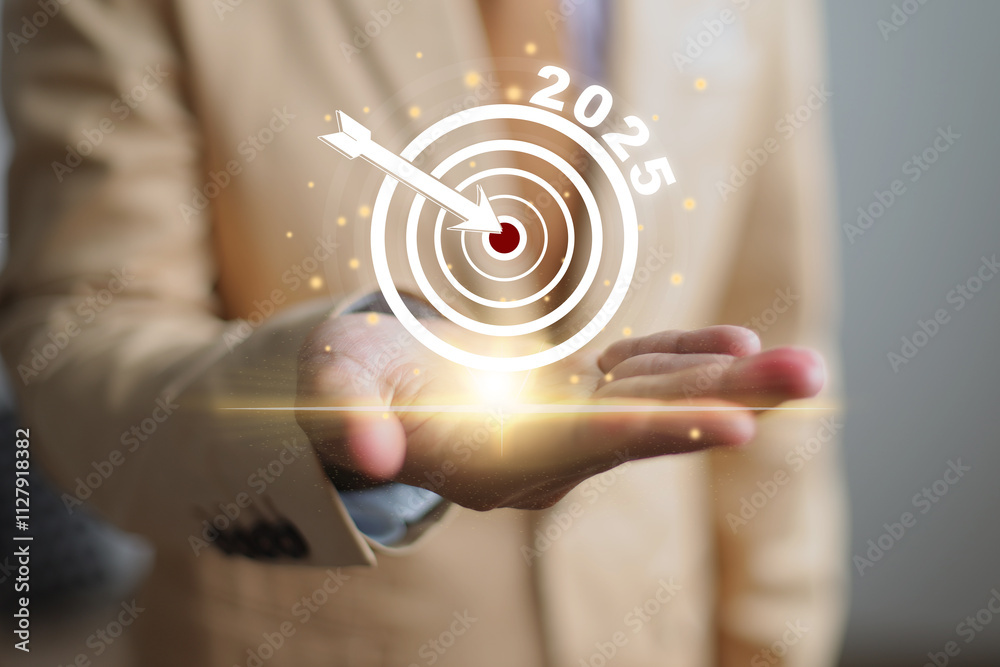 Hands Showing Target Icon The 2025 on Virtual Screen For New Year Business Goals Concept