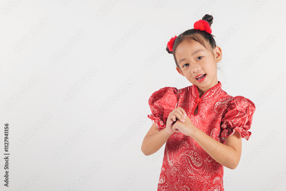 Happy Chinese New Year Asian girl in traditional red cheongsam qipao dress making a congratulatory gesture. Perfect for festive themes, isolated on a white Happy Chinese New Year Asian girl in traditional red cheongsam qipao dress making a congratulatory gesture. Perfect for festive themes, isolated on a white