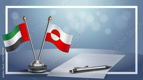 United Arab Emirate and Greenland National flags on small table with bokeh background, cooperative relationship