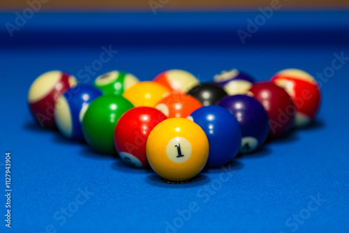 Billiards table and balls on a blue table. photo