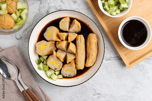 Pempek or Indonesian fish cake. Made from fish and flour. served with cuko. originated from palembang, sumatera. Perfect for recipe, article, catalogue, photo illustration, or any commercial purposes. photo