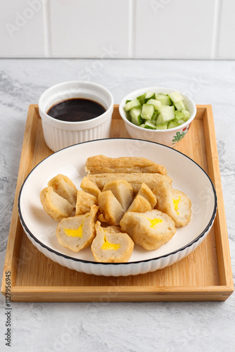 Pempek or Indonesian fish cake. Made from fish and flour. served with cuko. originated from palembang, sumatera. Perfect for recipe, article, catalogue, photo illustration, or any commercial purposes. photo