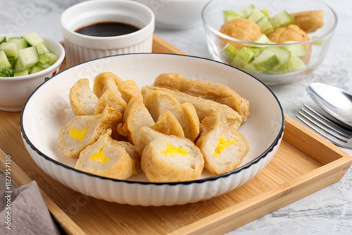 Pempek or Indonesian fish cake. Made from fish and flour. served with cuko. originated from palembang, sumatera. Perfect for recipe, article, catalogue, photo illustration, or any commercial purposes. photo