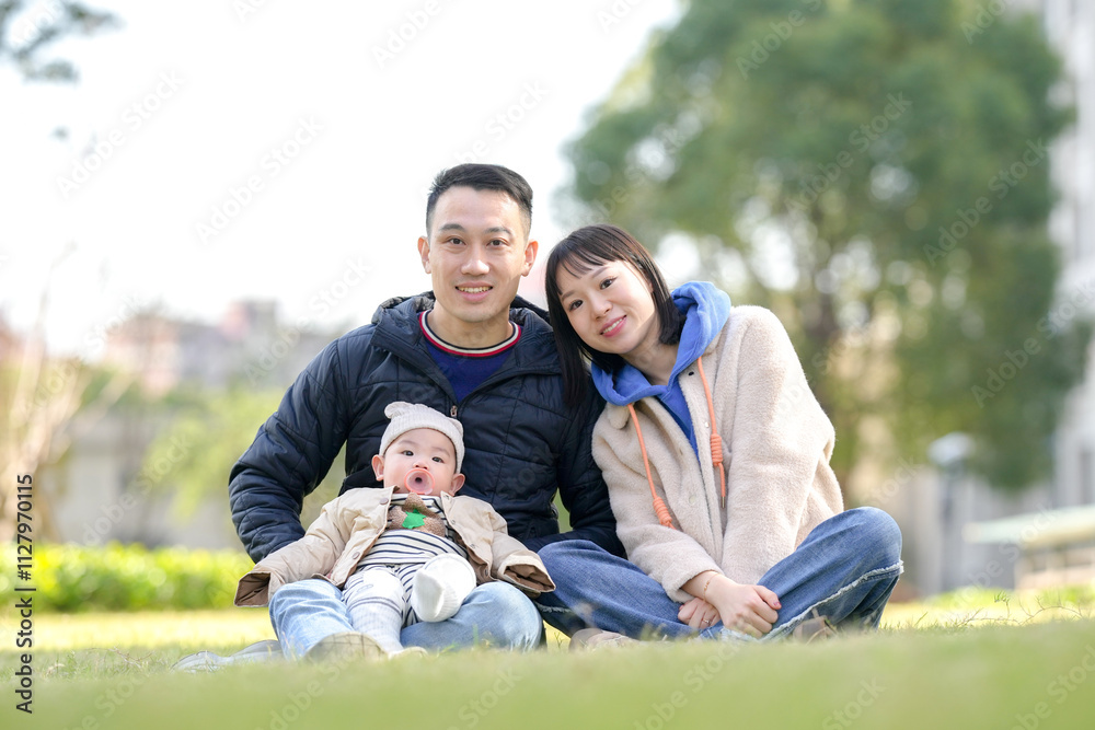 A 6-month-old boy plays with his mother and father from a Chinese family in a private garden in Pudong New Area, Shanghai, China. A 6-month-old boy plays with his mother and father from a Chinese family in a private garden in Pudong New Area, Shanghai, China.