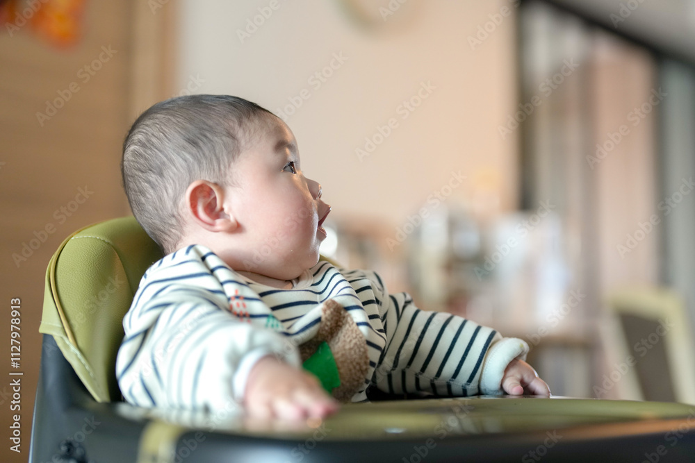 A 6-month-old boy has his mouth wiped by his mother from a Chinese family on a cold winter day in an apartment building in Pudong New District, Shanghai, China. A 6-month-old boy has his mouth wiped by his mother from a Chinese family on a cold winter day in an apartment building in Pudong New District, Shanghai, China.