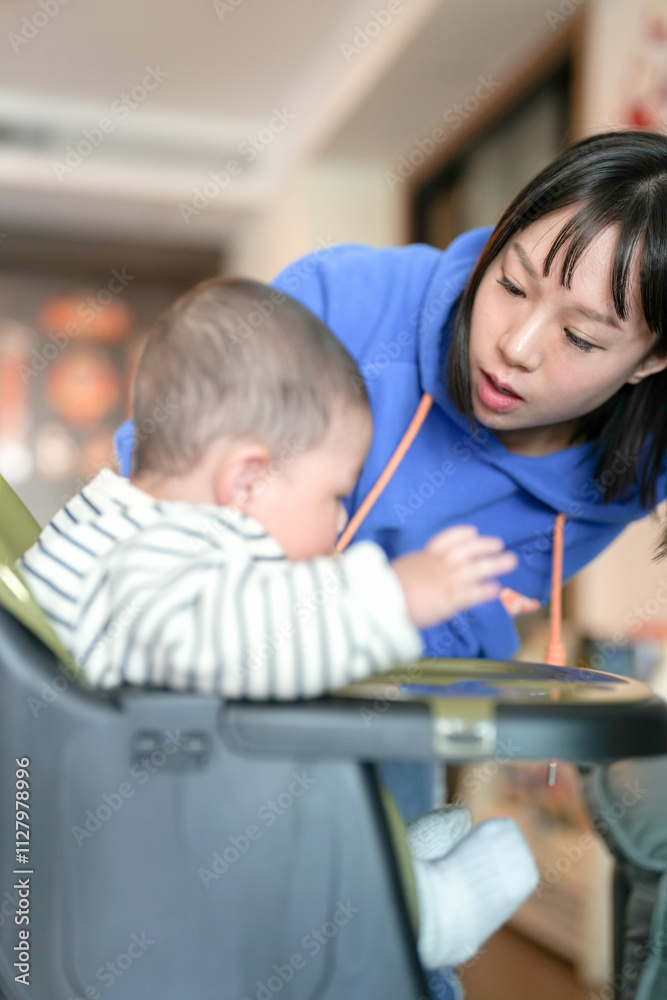 A 6-month-old boy has his mouth wiped by his mother from a Chinese family on a cold winter day in an apartment building in Pudong New District, Shanghai, China. A 6-month-old boy has his mouth wiped by his mother from a Chinese family on a cold winter day in an apartment building in Pudong New District, Shanghai, China.