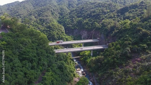 drone footage of tunnels connected by bridge