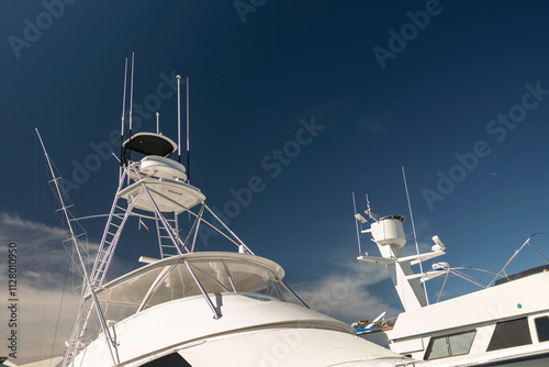 Flybridge of a fishing yacht under blue sky. photo