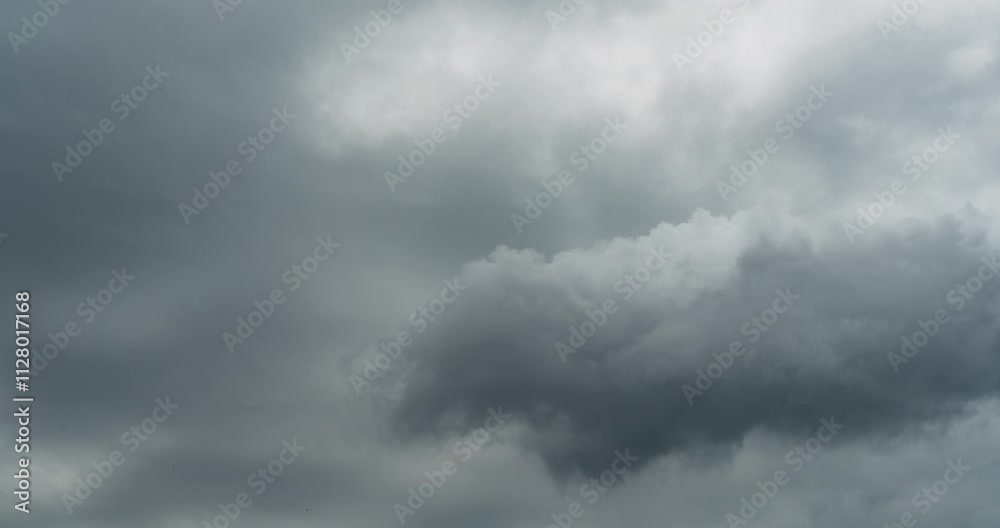 Timelapse of isolated storm cloud dispersing in the dark sky Timelapse of isolated storm cloud dispersing in the dark sky