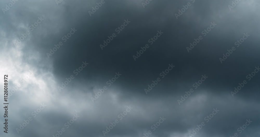 Timelapse of volatile storm clouds brewing in the dark sky
