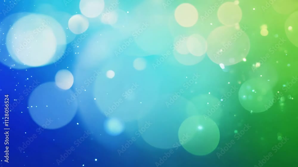 Video features a blue and green gradient with shimmering sparkles and bokeh lights